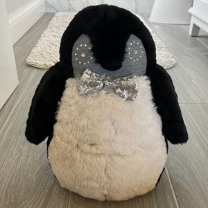 Pottery Barn teen stuffed penguin with built in speakers.